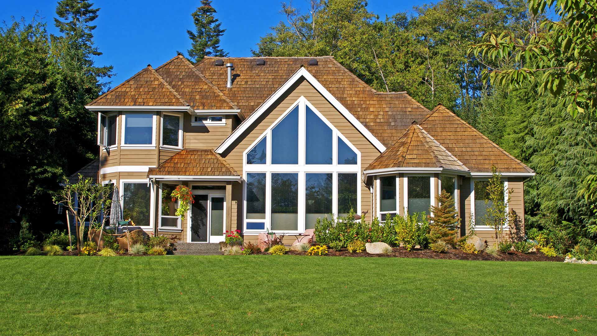 This house in Glenrose, WA has a large lawn that requires fertilization and weed control treatments.