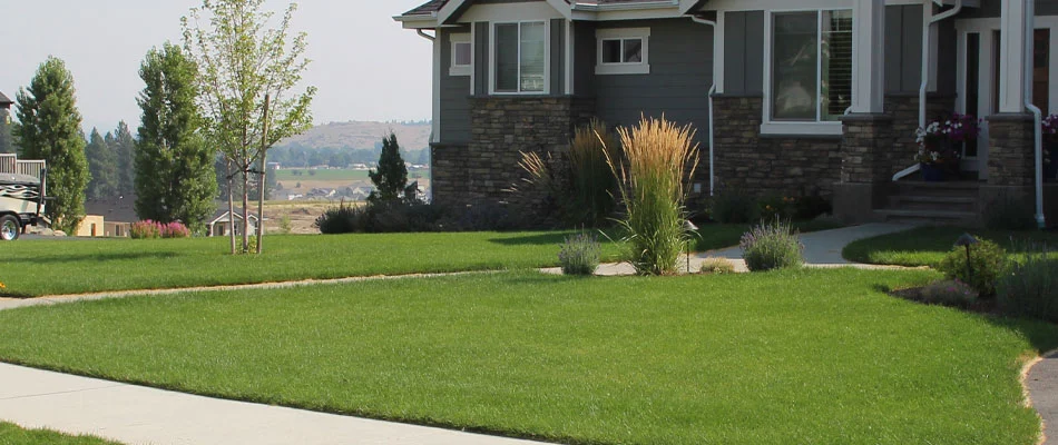 This home in South Hill, WA uses our lawn care services and shrub bed weed control.