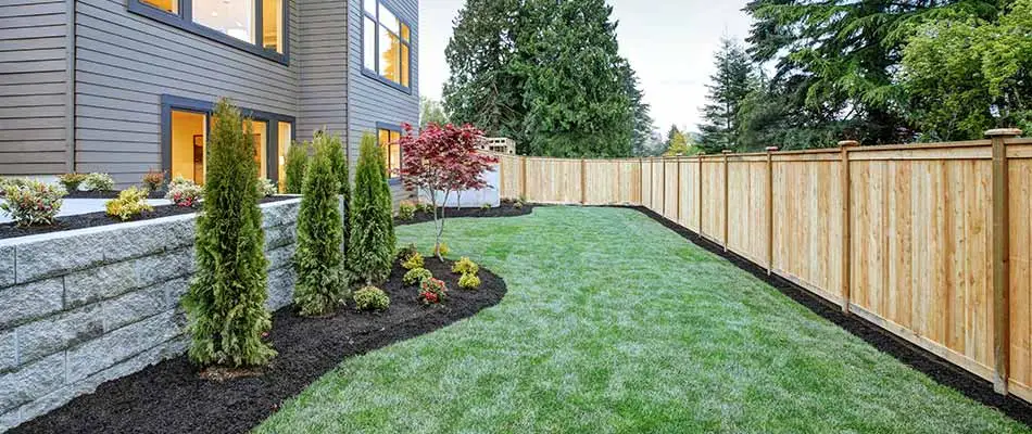 This property in Spokane Valley uses regular lawn care treatments and shrub bed weed control.