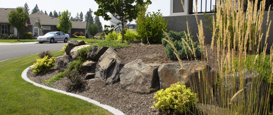 Landscaping bed in front of a house in Spokane Valley that is free of any weeds.